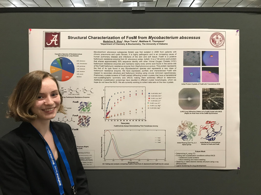 Maddie Shay in front of her research poster